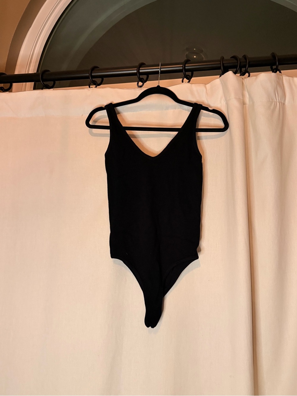 Women’s Black Ribbed One-Piece Bodysuit